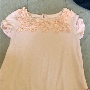 A pink short sleeve shirt